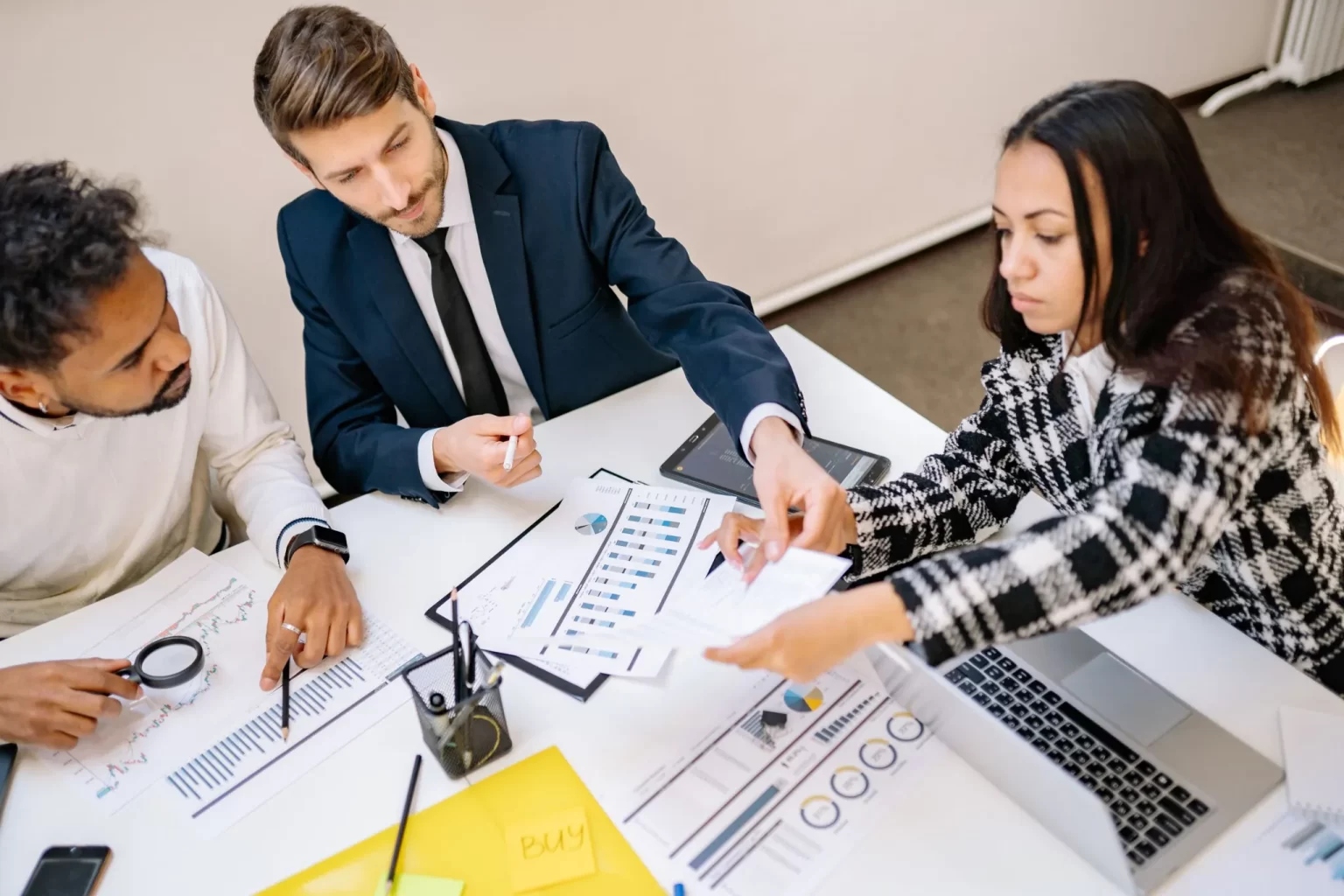 Team of consultants reviewing project results in a meeting